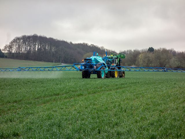 The picture shows a tractor in the field.