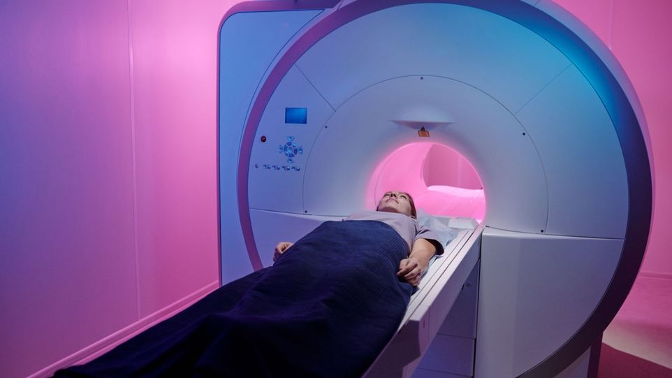 Woman is pushed into MRI