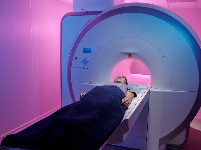 Woman is pushed into MRI