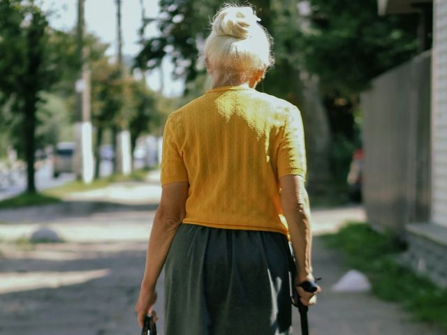 An elderly lady seen from behind